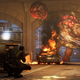 A giant zombie throws a ball of gross stuff at four people standing in a tunnel in Back 4 Blood.